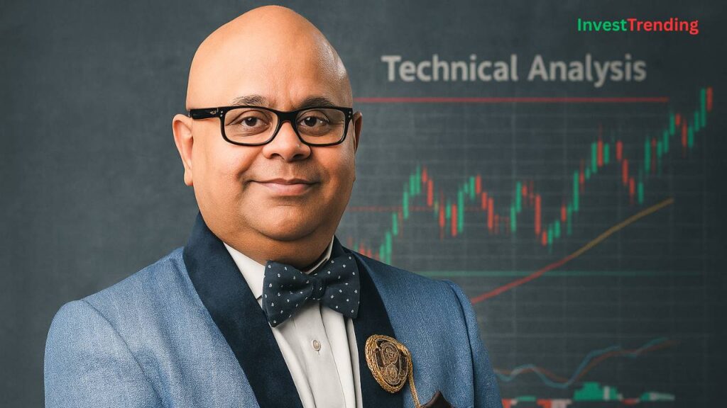 Ashwani Gujral, wearing a blue suit and bow tie, stands confidently in front of a trading chart showing technical analysis patterns, with the InvestTrending brand in the corner.